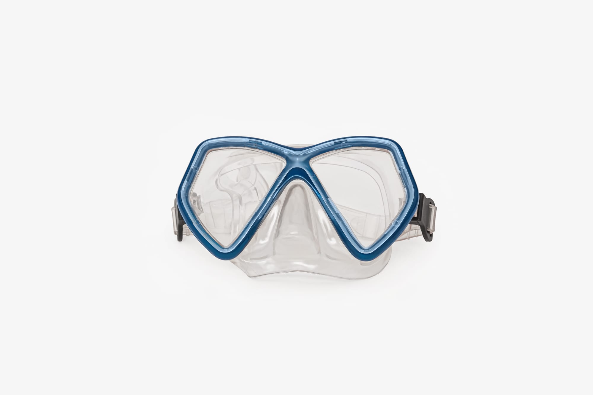 A double lens scuba diving mask, transparent and blue