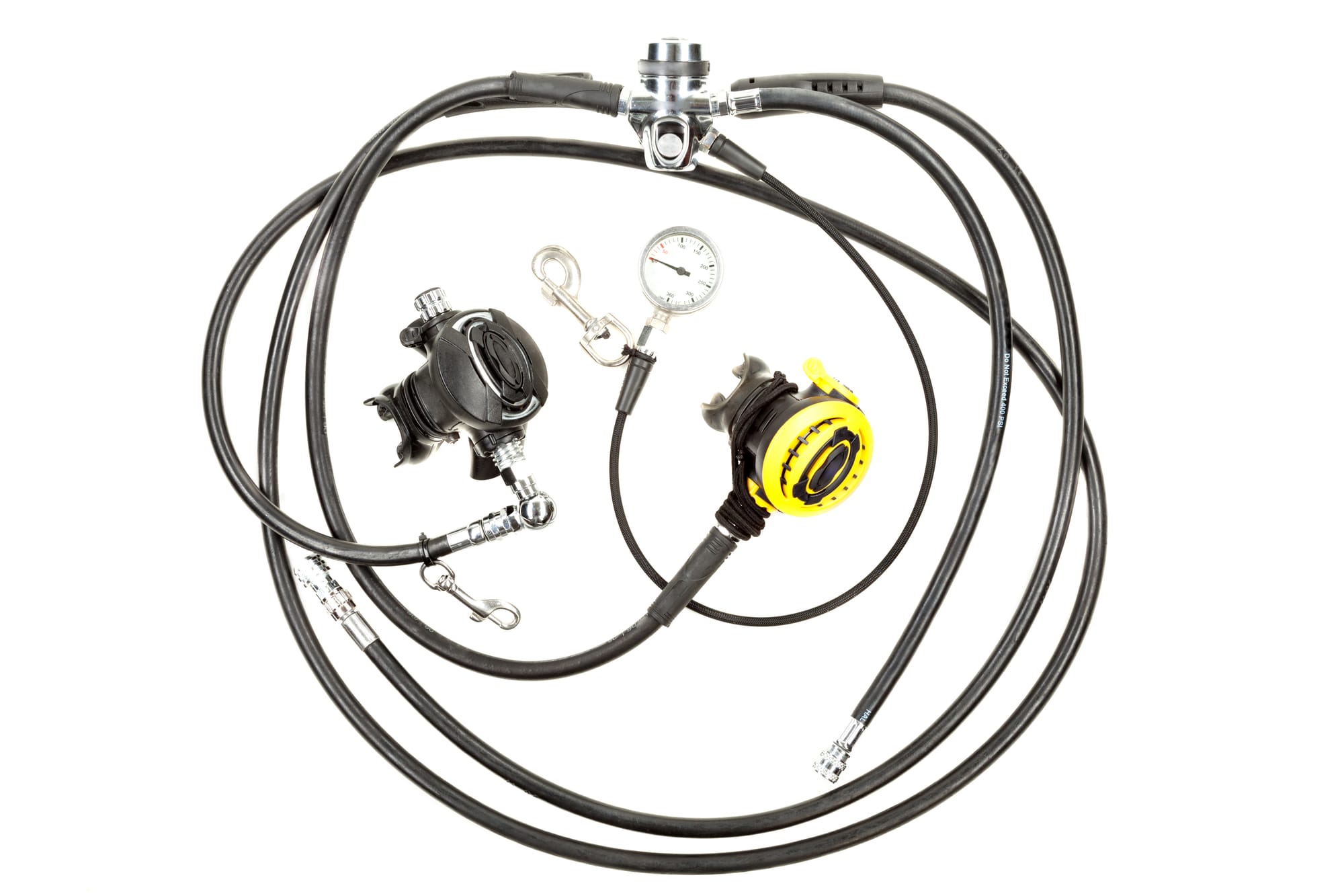 A scuba diving regulator with second stages, inflator hoses, and a pressure gauge