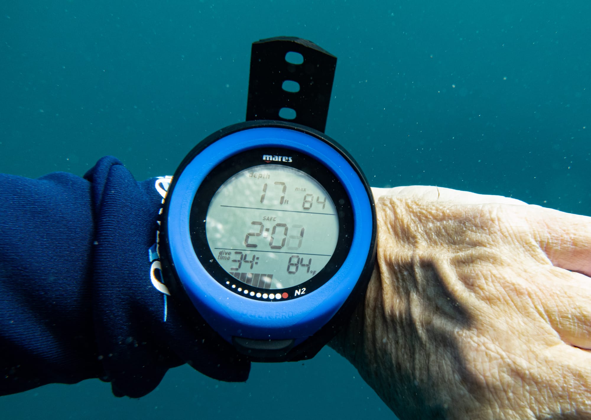 Blue scuba diving computer during the safety stop at the end of the dive