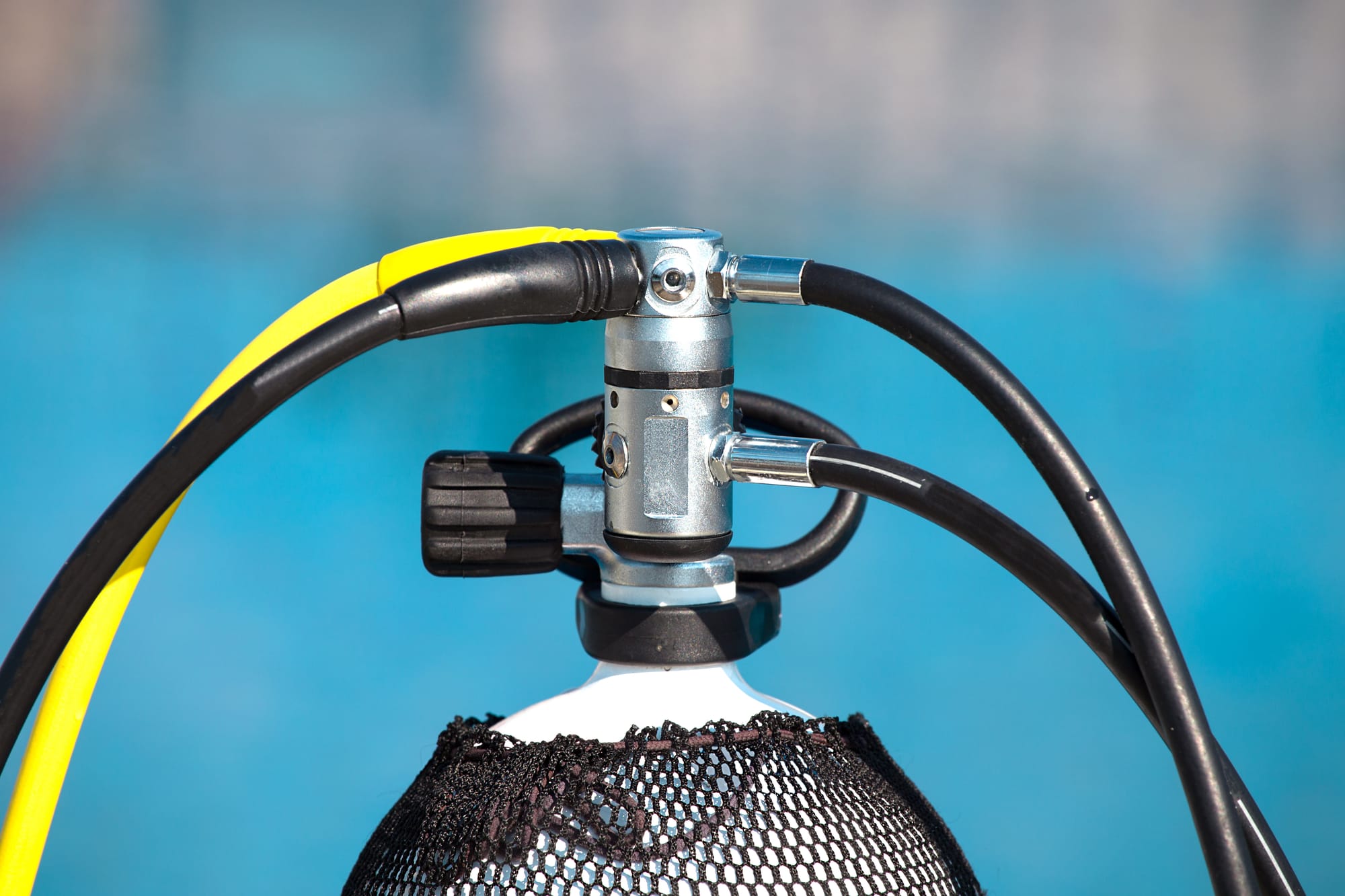 First stage regulator connected to a scuba diving tank