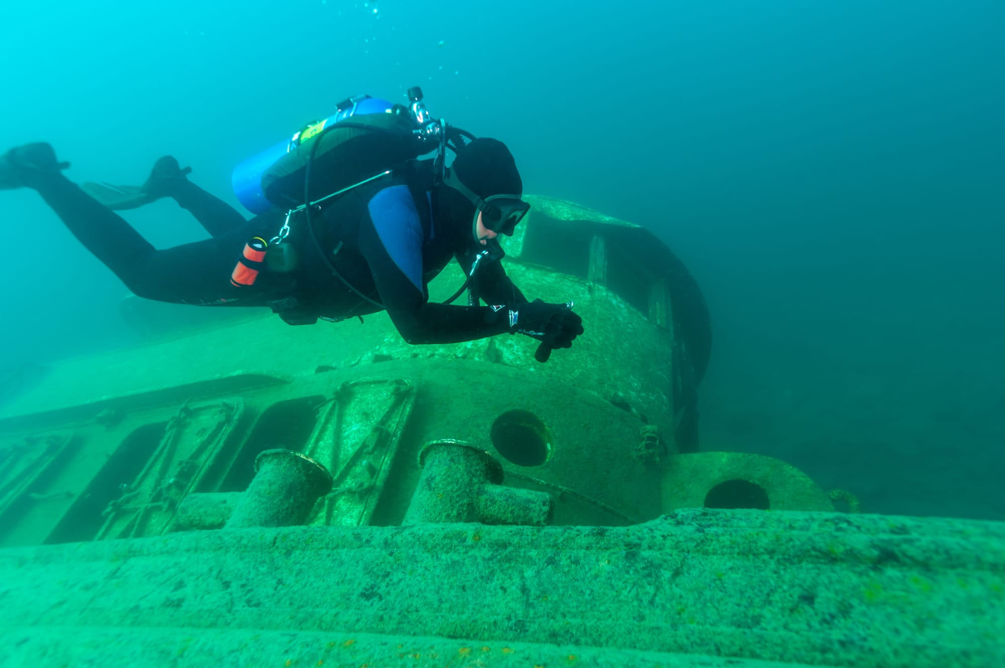 A scuba diver on a wreck, breathing an enriched air nitrox mix