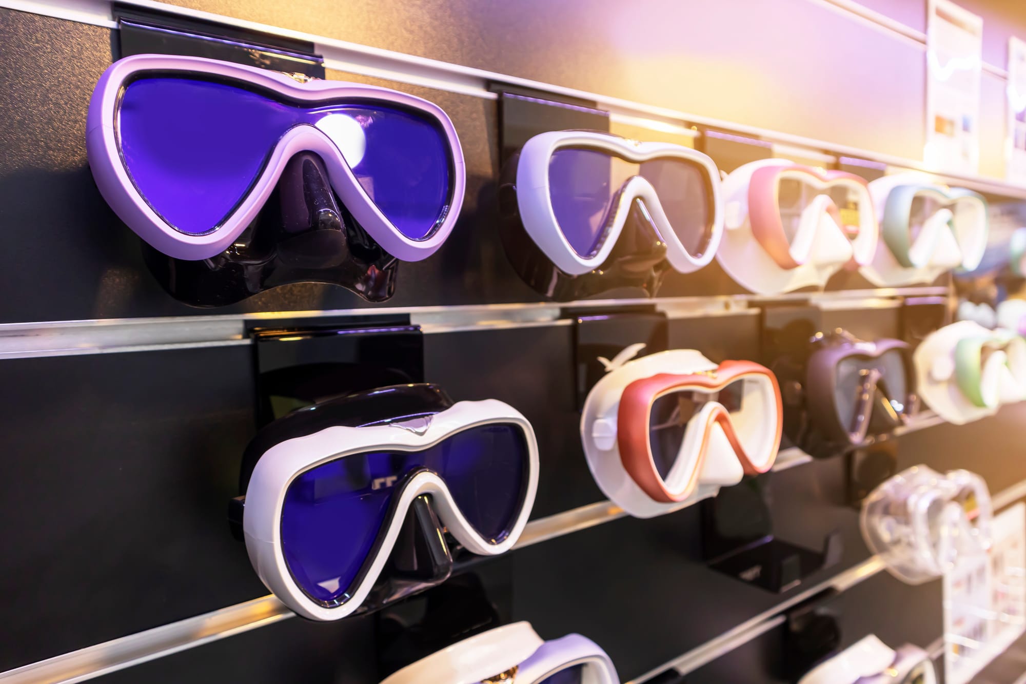 A wide selection of scuba diving masks in a shop