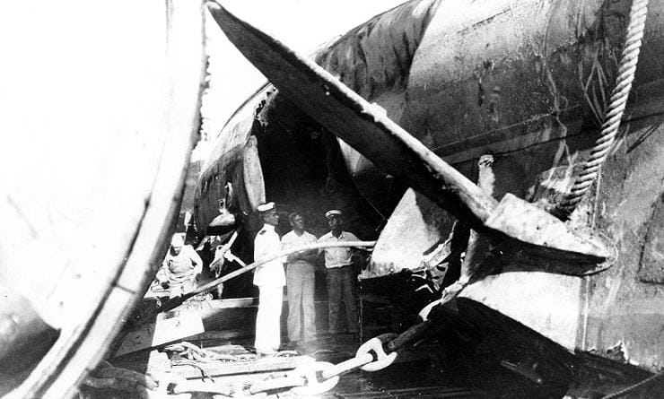 U.S. Navy next to the recovered USS-F4 submarine, a submarine sunk in 1915