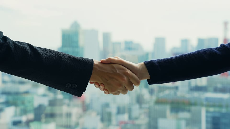 Business people handshaking
